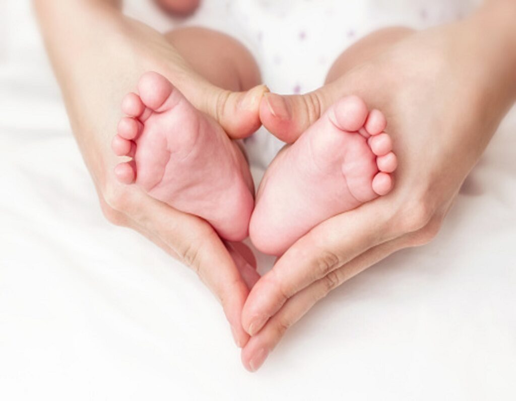 Baby feet in mother hands